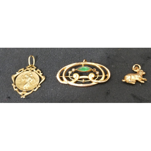 424 - A 9ct gold charm in the form of a rabbit, a gold drop St. Christopher pendant and a gold brooch (3),... 