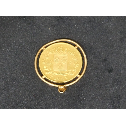 442 - A Louis XVIII gold 40 franc, 1818, soldered into circular pendant, 15.6 grams,