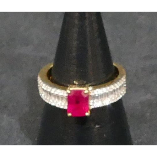 447 - An 18ct gold ladies ring set with centre ruby and flanked by various shaped diamonds, Size N, 5.9 gr... 