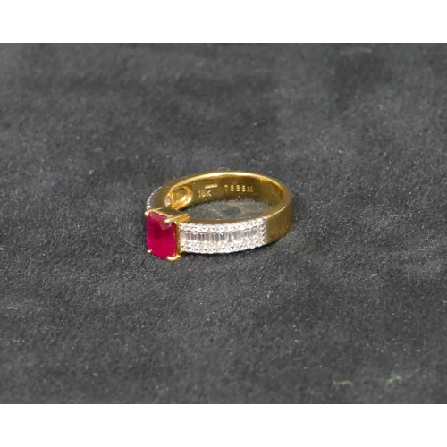 447 - An 18ct gold ladies ring set with centre ruby and flanked by various shaped diamonds, Size N, 5.9 gr... 