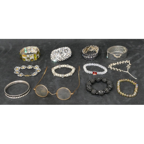 451 - 10 various costume bangles and bracelets, a pair of spectacles (11)