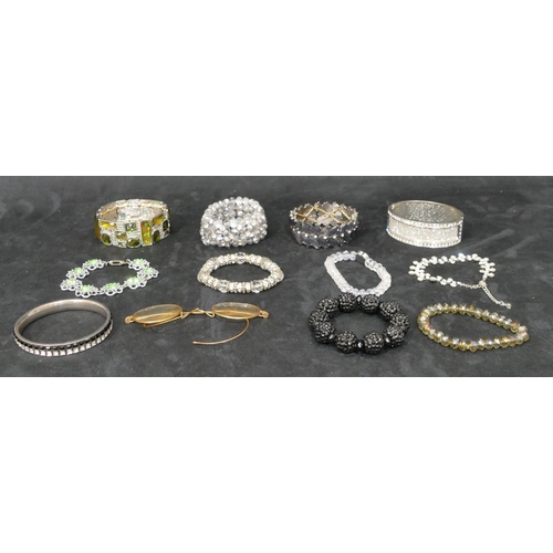 451 - 10 various costume bangles and bracelets, a pair of spectacles (11)