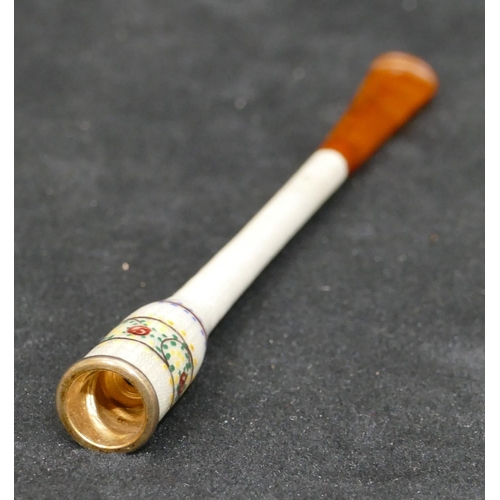 453 - An enamelled cheroot holder with multi-coloured floral decoration, 11.5cm long (cased)