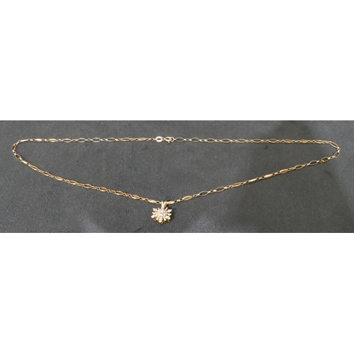 461 - A 9ct gold drop star pendant set with small diamonds with 9ct gold chain, chain 2.9 grams