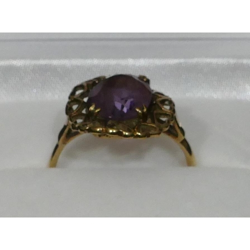 463 - A 9ct gold ladies amethyst ring with pierced rim in the form of hearts, Size L/M, 2.8 grams gross