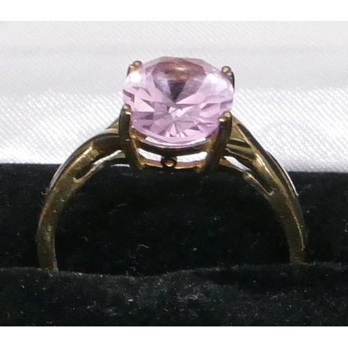 464 - A gold ladies ring set with oval purple stone, Size Y/Z, 4.6 grams