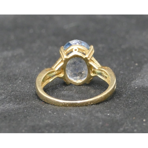 465 - A gold ladies ring set with oval pale stone, Size S/T, 4.4 grams gross