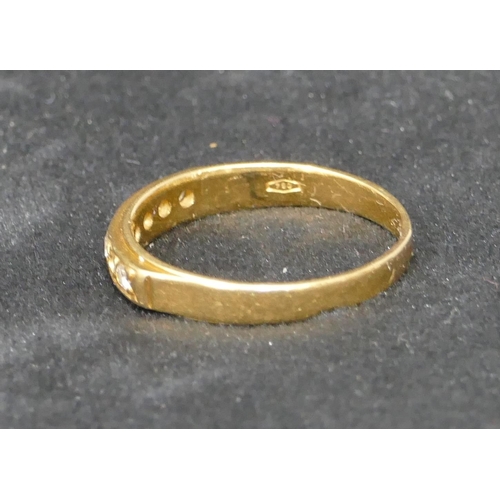 466 - An 18ct gold half eternity ring, set with 7 diamonds, Size S, 3.6 grams gross