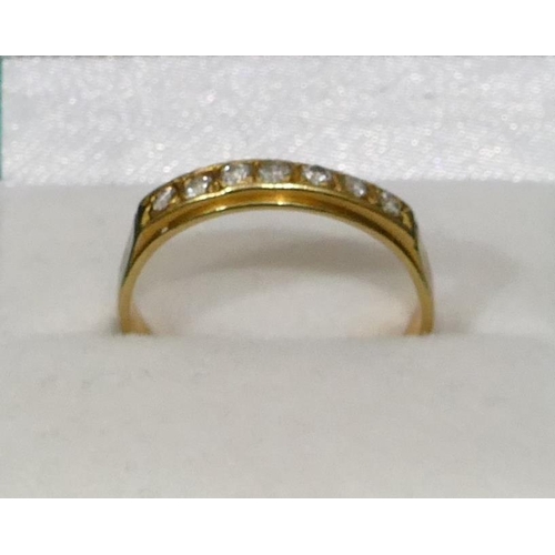 466 - An 18ct gold half eternity ring, set with 7 diamonds, Size S, 3.6 grams gross