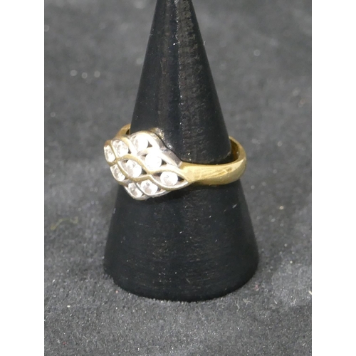 467 - An 18ct gold cluster ring set with clear stones, Size O, 4 grams gross