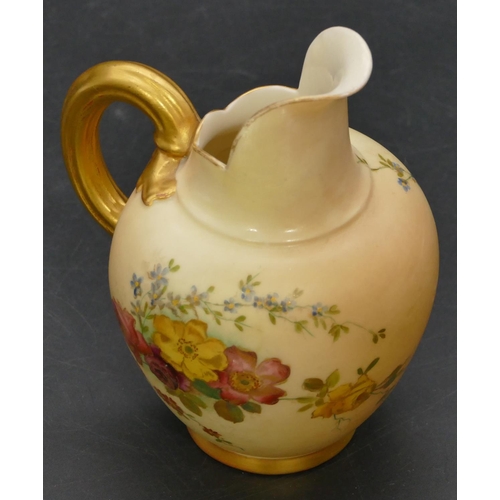 48 - A Royal Worcester blush round bulbous shaped jug with hand painted floral, leaf and gilt decoration,... 