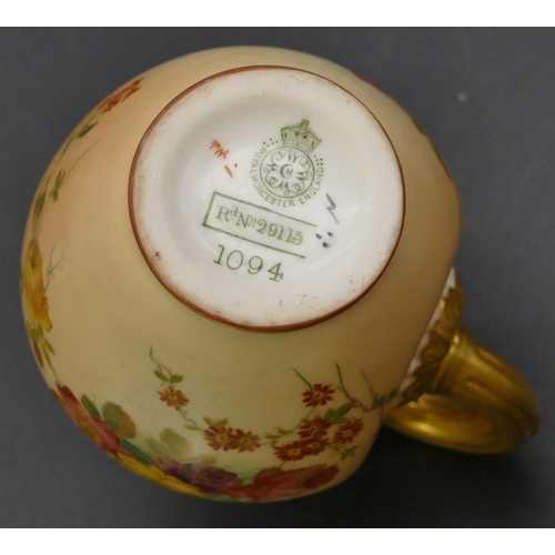 48 - A Royal Worcester blush round bulbous shaped jug with hand painted floral, leaf and gilt decoration,... 