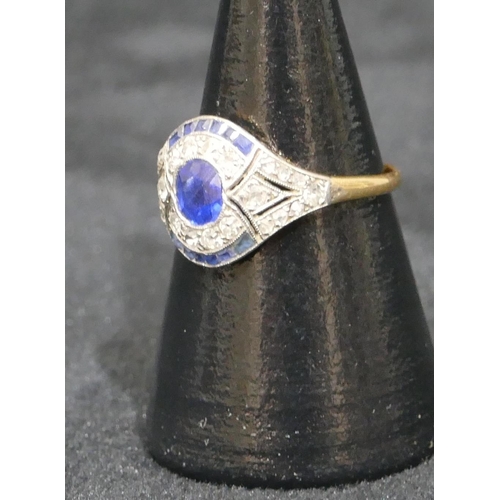 482 - An Art Deco gold ladies ring set with centre sapphire and surrounded by 24 diamonds and 12 further s... 