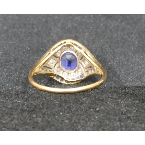 482 - An Art Deco gold ladies ring set with centre sapphire and surrounded by 24 diamonds and 12 further s... 