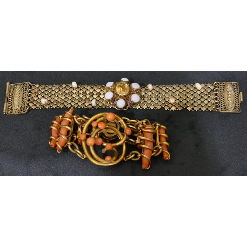 496 - A gilt metal and coral bracelet, 18cm long and a Sterling silver gilt bracelet mounted with centre c... 