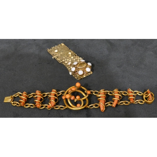 496 - A gilt metal and coral bracelet, 18cm long and a Sterling silver gilt bracelet mounted with centre c... 