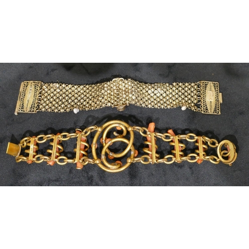 496 - A gilt metal and coral bracelet, 18cm long and a Sterling silver gilt bracelet mounted with centre c... 