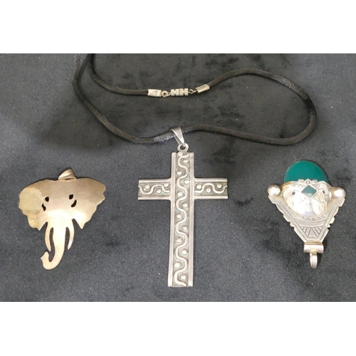 497 - A Mexican 925 silver cross pendant with cord chain and 2 other silver pendants. (3)