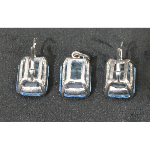 501 - A pair of aquamarine style earrings and a similar drop pendant. (3)