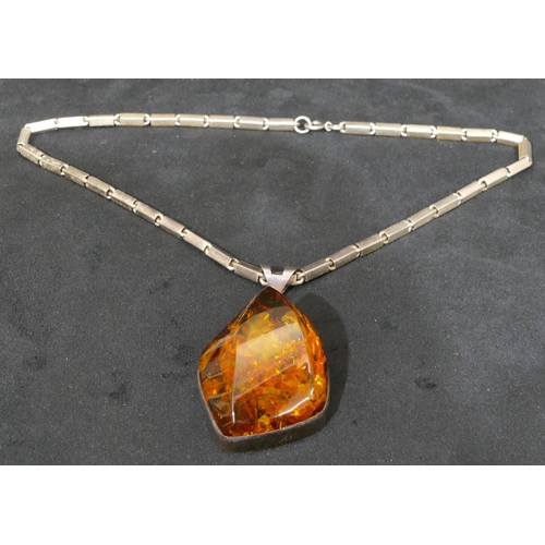 505 - A silver and large amber nugget pendant with square silver chain, 46cm long.