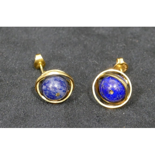 516 - A pair of gold covered lapiz lazuli ball shaped drop earrings, 7.4 grams gross.