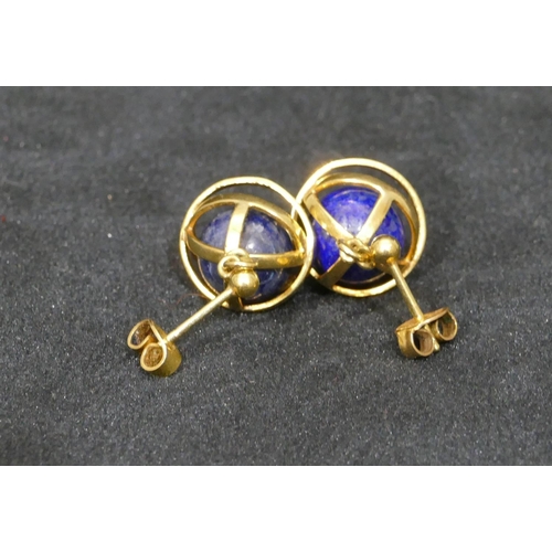 516 - A pair of gold covered lapiz lazuli ball shaped drop earrings, 7.4 grams gross.