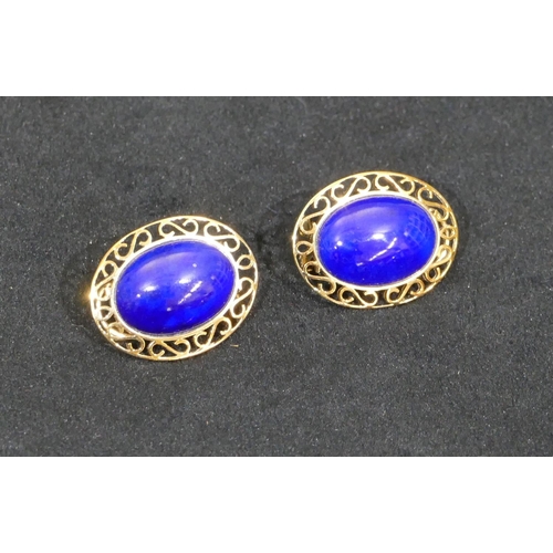 518 - A pair of 14ct gold oval earrings set with centre lapis lazuli, with pierced rims, 3.5cm high, 9.4 g... 