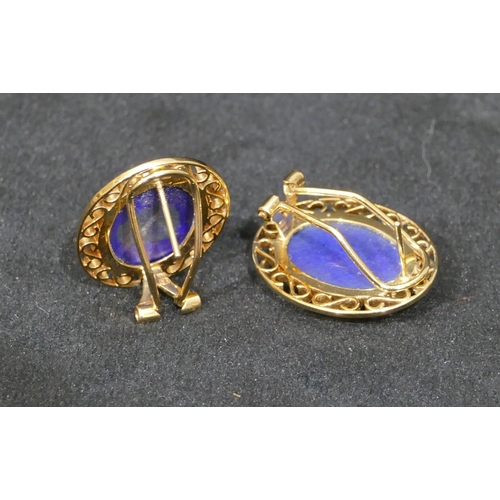 518 - A pair of 14ct gold oval earrings set with centre lapis lazuli, with pierced rims, 3.5cm high, 9.4 g... 