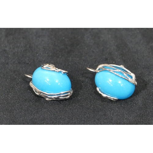 520 - A pair of 18ct white gold oval turquoise earrings, 2.5cm high overall, 11.1 grams.