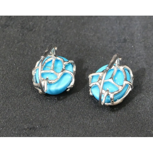 520 - A pair of 18ct white gold oval turquoise earrings, 2.5cm high overall, 11.1 grams.