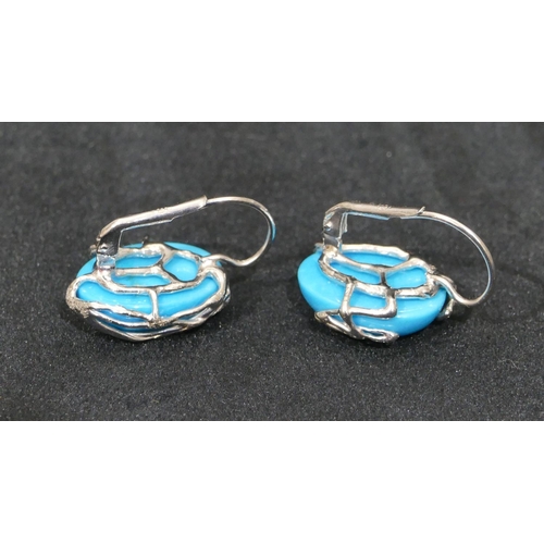 520 - A pair of 18ct white gold oval turquoise earrings, 2.5cm high overall, 11.1 grams.