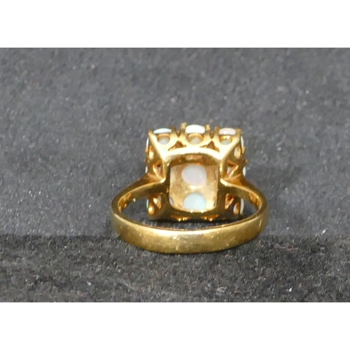 522 - An 18ct gold square ladies cluster ring set with 9 opals, size N/O, 5.2 grams gross.