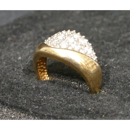 523 - A 14ct 2-coloured gold ring set with 12 diamonds, size M, 5.5 grams gross.