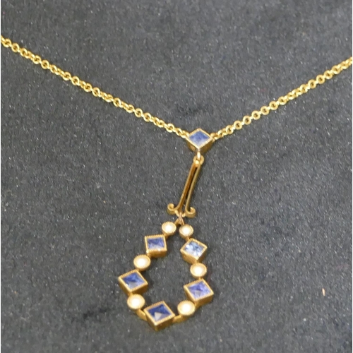 537 - A 15ct gold drop pendant with chain, set with square cut sapphires and half pearls, 37.5cm long, 3.1... 