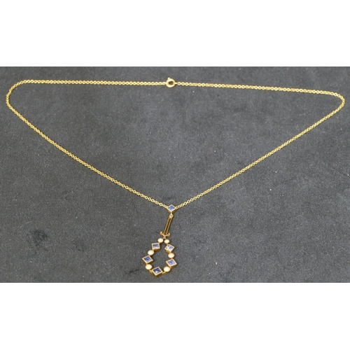 537 - A 15ct gold drop pendant with chain, set with square cut sapphires and half pearls, 37.5cm long, 3.1... 