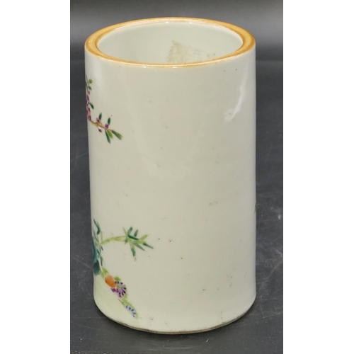 54 - An Oriental cylindrical brush pot on white ground with multi-coloured bird, branch and floral decora... 