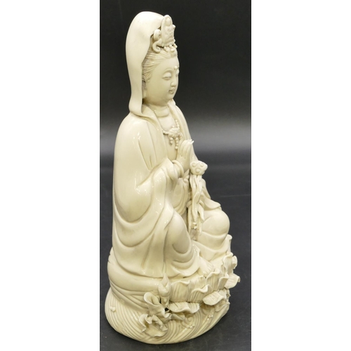 55 - An Oriental blanc-de-chine figure of a seated goddess, 26cm high.