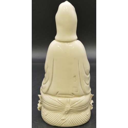 55 - An Oriental blanc-de-chine figure of a seated goddess, 26cm high.