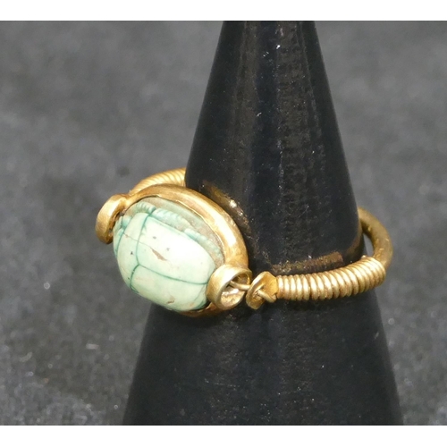 550 - An Egyptian high ct gold  scarrab ring, size O, 3.8 grams gross.