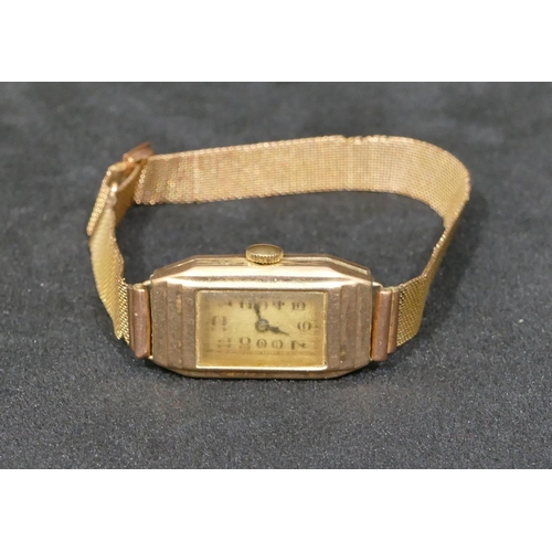 558 - A 9ct gold rectangular faced wristwatch with matching strap bracelet, silvered dial with Arabic nume... 