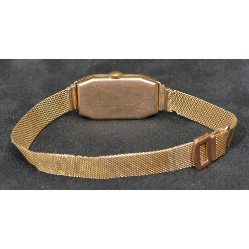 558 - A 9ct gold rectangular faced wristwatch with matching strap bracelet, silvered dial with Arabic nume... 