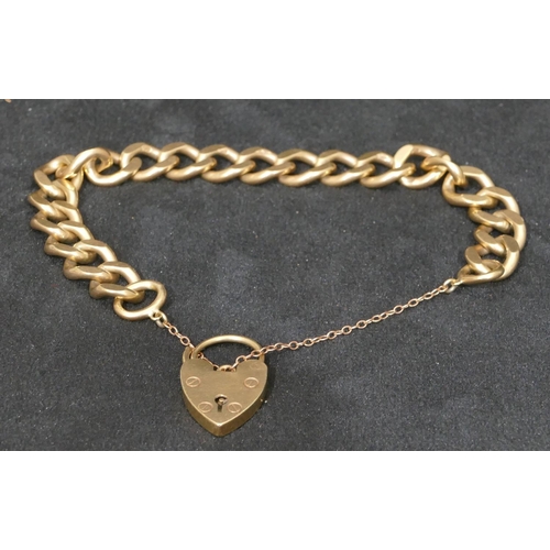 560 - A 9ct gold linked bracelet with padlock clasp, 41.1 grams.