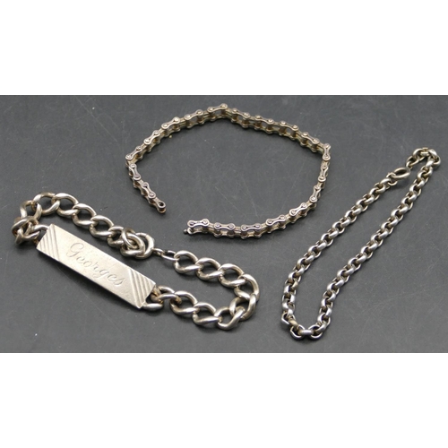 563 - A silver identity bracelet, a silver bracelet in form of a bike chain and another silver bracelet, 5... 