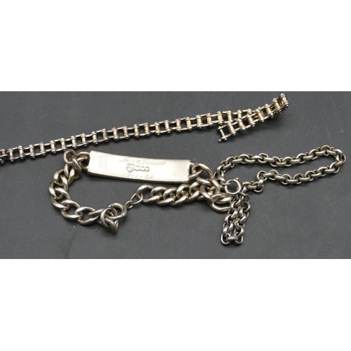 563 - A silver identity bracelet, a silver bracelet in form of a bike chain and another silver bracelet, 5... 