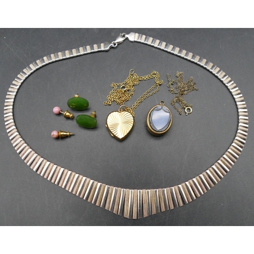 568 - A 925 silver necklace, a 9ct gold front and back heart shaped locket with chain, an oval hardstone l... 