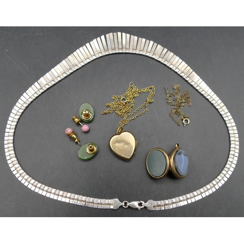 568 - A 925 silver necklace, a 9ct gold front and back heart shaped locket with chain, an oval hardstone l... 