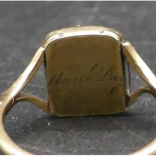 571 - A 9ct gold mourning ring set with half coral, engraved to back 