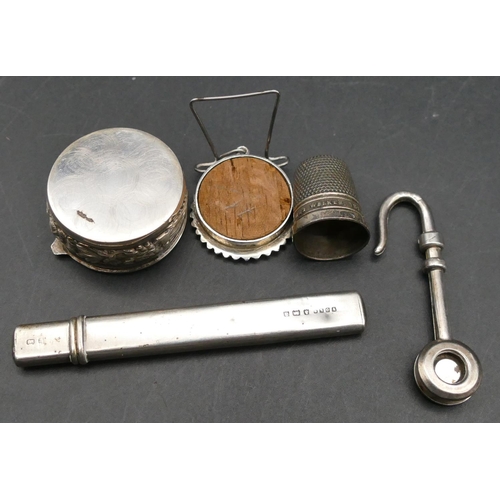 572 - A silver pendant hook, a silver pencil in matching sheath, a Birmingham silver thimble, a pill box w... 