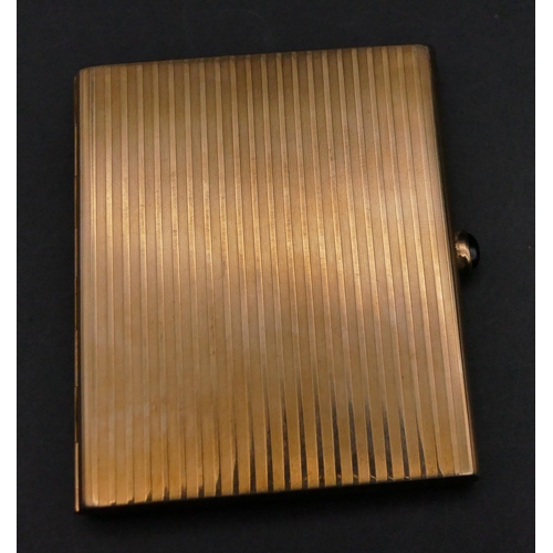 581 - A 14ct gold cigarette case with engine turn decoration, hinged front with sapphire cabochon button, ... 