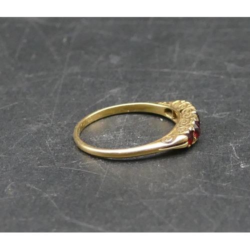 583 - A ladies gold 5 stone ring set with graduated garnets, Size O/P, 2.8 grams gross